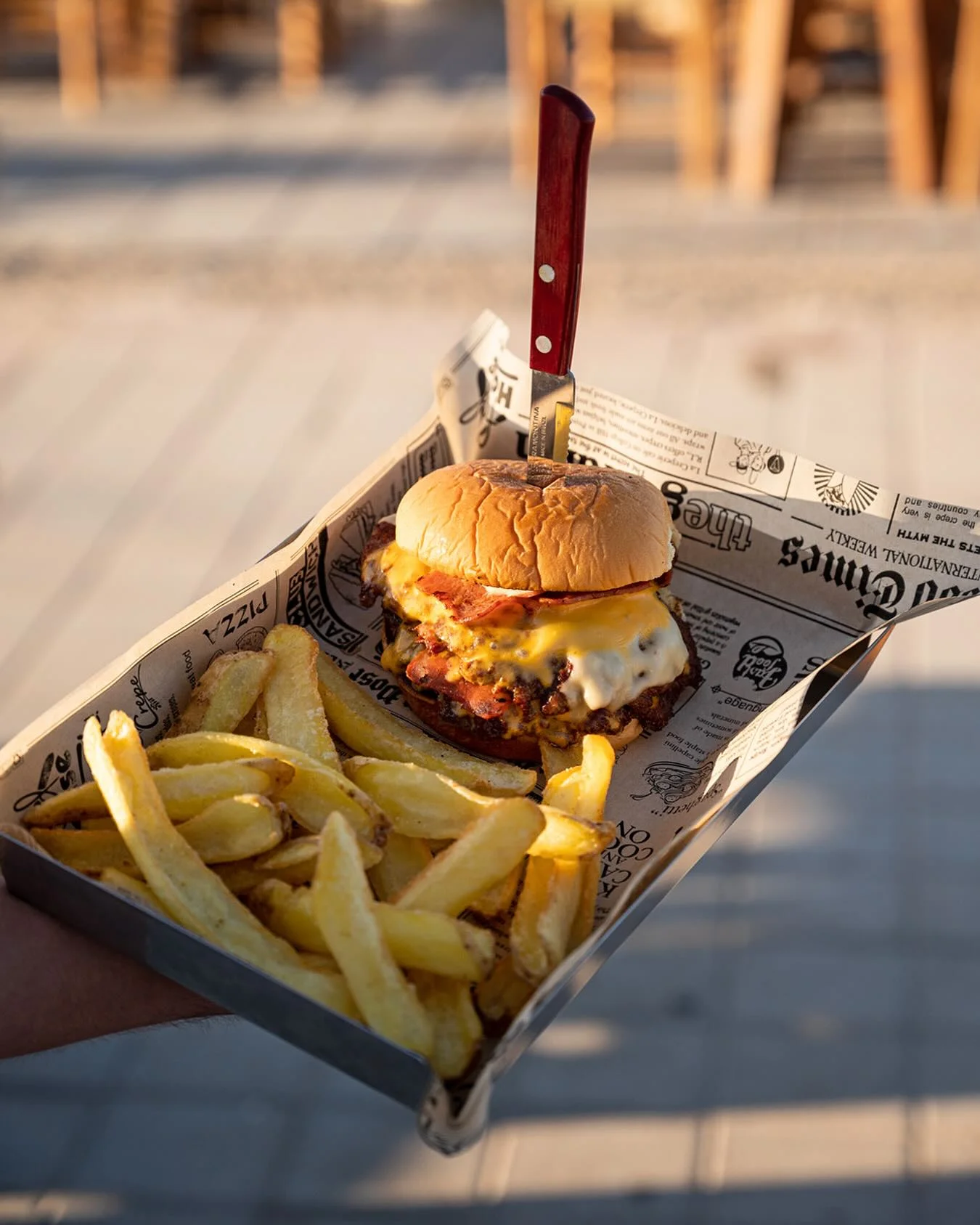 Double smash burger with bacon and cheddar served with fries